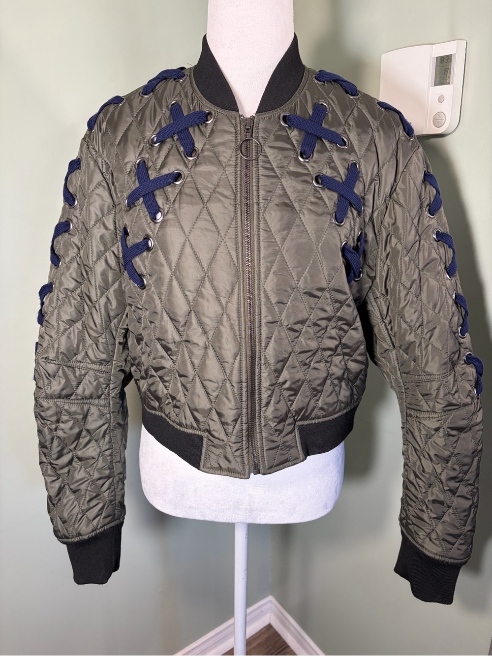 BCBGMaxazria Olive Quilted Bomber Jacket with Navy Lace-Up Detail